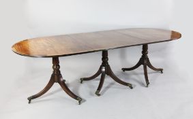 A Regency style triple pillar mahogany D end dining table, extends to 11ft 3in. A Regency style