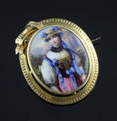 A continental gold mounted enamel portrait brooch, 1.75in. A continental gold mounted enamel