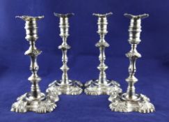 A matched set of four George II cast silver candlesticks, with Morland eagle crest, London 1749-
