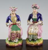 A pair of Staffordshire seated figures of a Turkish man and woman, mid 19th century, 7.25in. A