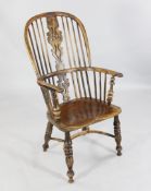 A 19th century Windsor yew wood armchair, A 19th century Windsor yew wood armchair, with stick