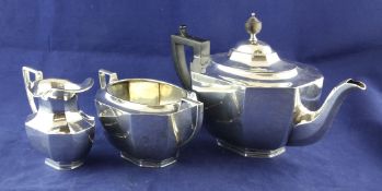 A George V silver three piece tea set, gross 35.5 oz. A George V silver three piece tea set, of