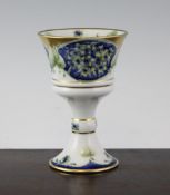 A William Moorcroft MacIntyre Lilac pattern Florian ware goblet, 5.75in. A William Moorcroft