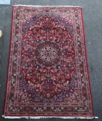 A Persian carpet, 10ft 8in by 6ft 10in. A Persian carpet, with central foliate medallion in a