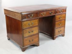An early 20th century George III style mahogany twin pedestal desk An early 20th century George