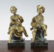 A pair of early 20th century gilt bronze figures modelled as a musical couple, 8.5in. A pair of
