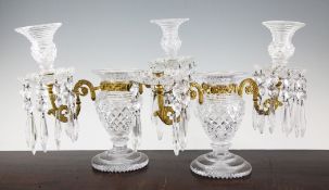 A pair of early 19th century twin branch candelabra, 14in. A pair of Regency cut glass and ormolu