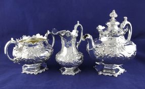 An ornate Victorian silver three piece tea set, by George Angell, gross 54.5 oz. An ornate Victorian