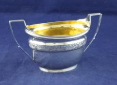 A George III silver oval two handled sugar bowl, 7.5 oz. A George III silver oval two handled