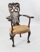 An early 20th century Continental carved mahogany open armchair, An early 20th century Continental