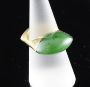 An 18ct gold and jadeite ring, size O. An 18ct gold and jadeite ring, with elliptical shaped