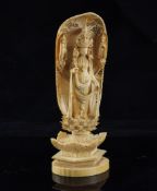 A Japanese ivory shrine figure of Kwannon, early 20th century, 7.3in. A Japanese ivory shrine figure