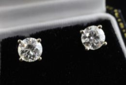 A pair of 18ct white gold and solitaire diamond ear studs, A pair of 18ct white gold and solitaire