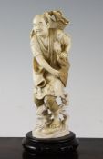 Japanese ivory fisherman A Japanese ivory figure of a fisherman, early 20th century, his net