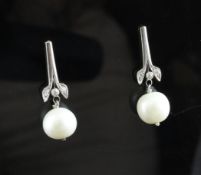 A pair of gold and silver, cultured pearl and diamond drop earrings, 1in. A pair of gold and silver,