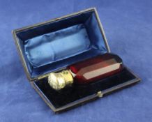 A cased 19th century continental gold mounted ruby glass scent bottle, 4in. A cased 19th century