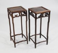 A pair of early 20th century Chinese stands A pair of early 20th century Chinese rosewood lamp