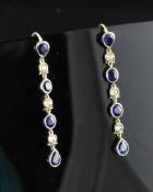 A pair of gold, sapphire and diamond set drop earrings, 1.5in. A pair of gold, sapphire and