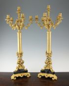 A pair of French gilt brass six branch candelabra, 27in. A pair of French gilt brass six branch