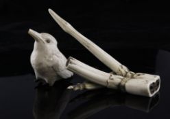 A Japanese ivory figure of a kingfisher and a stag horn carving A Japanese ivory figure of a