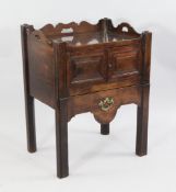 A George III mahogany night commode, W.2ft 1in. A George III mahogany night commode, with three