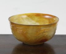 A Chinese agate bowl, 3.6in. (9.3cm) A Chinese agate bowl, carved in relief with two pair of birds
