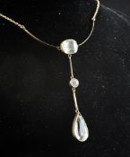 An Edwardian gold and three stone aquamarine drop pendant necklace, drop 2.75in. An Edwardian gold