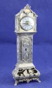 A late 19th/early 20th century continental repousse silver miniature longcase clock, decorated