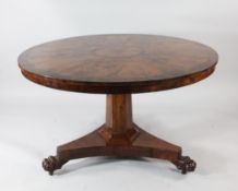 A Victorian yew wood circular breakfast table, with segmented veneered top and rosewood