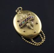 A Victorian pinchbeck and gem set "Regard" pendant, of oval form, with sphere and foliate