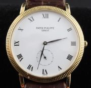 A gentleman`s 18ct gold Patek Philippe Calatrava manual wind wrist watch, with Roman dial and