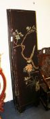 An early 20th century Japanese black lacquered eight fold room screen, decorated with figures