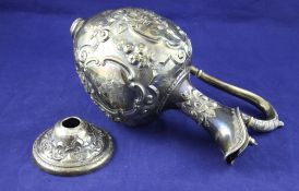 A Victorian silver hot water jug, of baluster form, with engraved initial and embossed with scrolls,