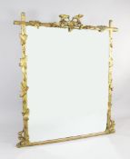 A 19th century carved giltwood square overmantel mirror, modelled as a rustic pole frame with oak