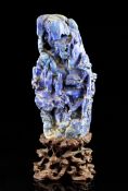 A Chinese lapis lazuli boulder carving, 18th/19th century, carved in high relief with two sages