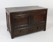 An 18th century oak mule chest, with panel front over two base drawers, W.3ft 6in.