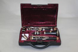 A Kohlerts & Sons ebony clarinet, with a Selmar gold seal button and fitted case
