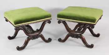 A pair of early Victorian rosewood X frame foot stools, with green fabric, overstuffed seats and