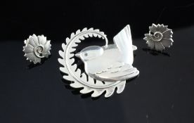 A 1960`s Georg Jensen sterling silver bird and curling fern brooch, numbered 309, 2in, together with
