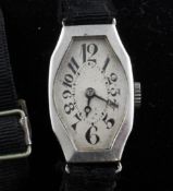 A lady`s 1940`s platinum manual wind wrist watch, of octagonal form, with tumbling Arabic