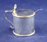 A George III silver drum mustard, with engraved armorial, beaded borders and pierced scalloped