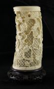 A Chinese export ivory tusk vase, early 20th century, carved in relief with scrolling dragons on a