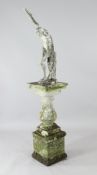 A reconstituted marble garden figure of a discus thrower, on an associated baluster column pedestal,