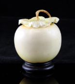 A Japanese stained ivory `persimmon` box and cover, late 19th/early 20th century, with