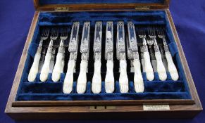 A cased set of twelve pairs of Victorian mother of pearl handled silver dessert eaters, with