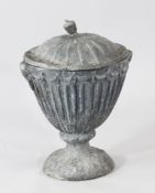 A classical lead garden urn with cover, on circular base, H.1ft 6in.