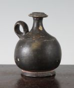 A Greek black glazed pottery Guttus flask, Souther Italy, c.4th century BC, of globular form, 4.