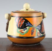 A Clarice Cliff Butterfly pattern biscuit barrel and cover, with cane work swing handle, printed