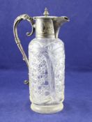 A Victorian silver plate mounted cut glass claret jug, of cylindrical form, with engraved foliate