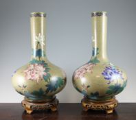 A pair of large Chinese cloisonne enamel bottle vases, each decorated with chrysanthemums and leaves